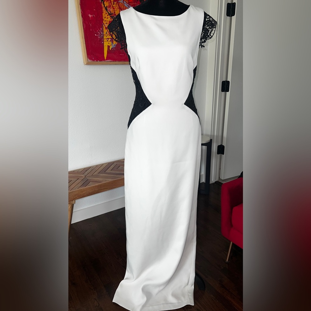 Beautiful formal gown with exquisite lace overlay inserts.